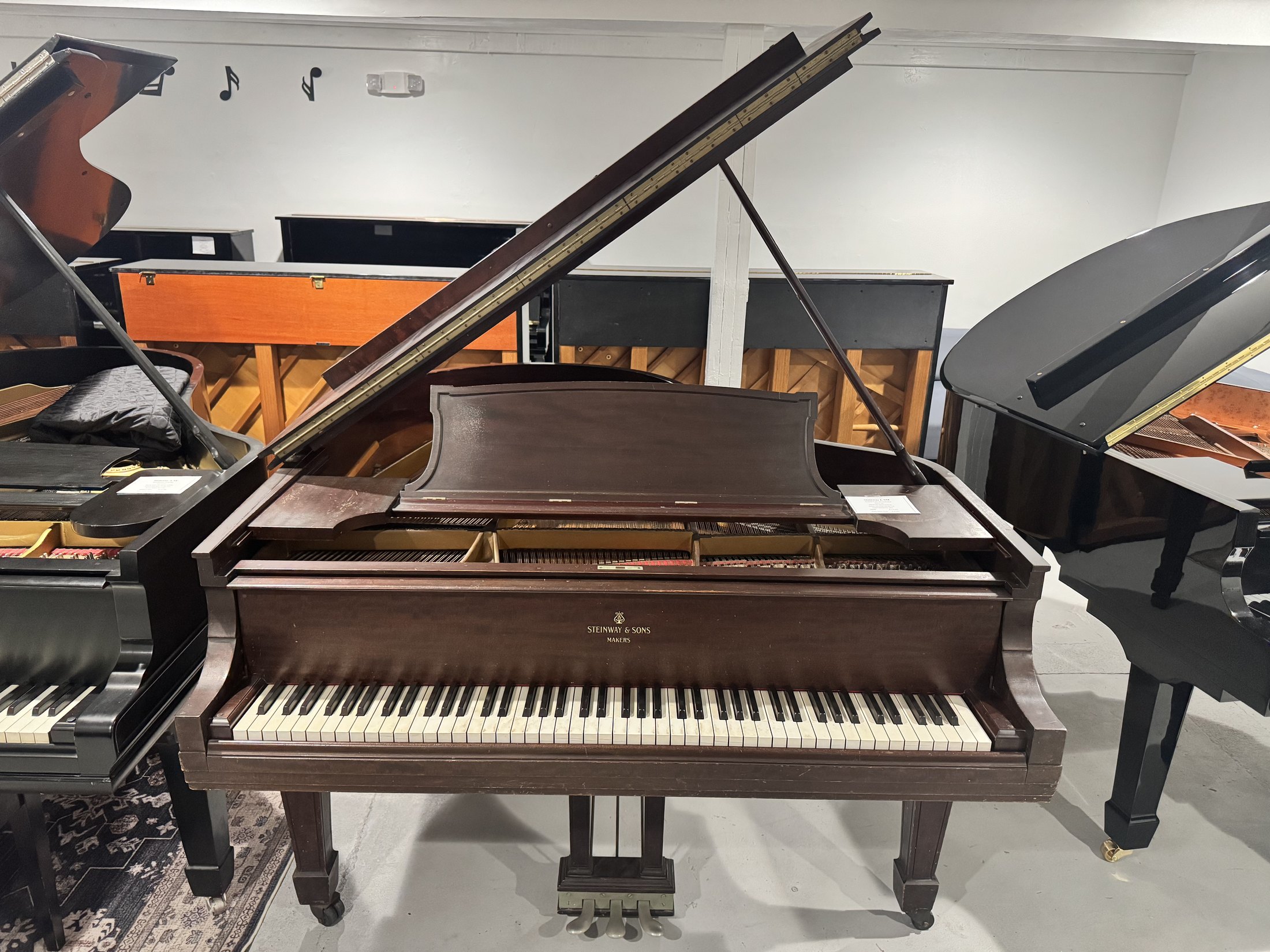 Steinway L SM baby grand piano showroom view